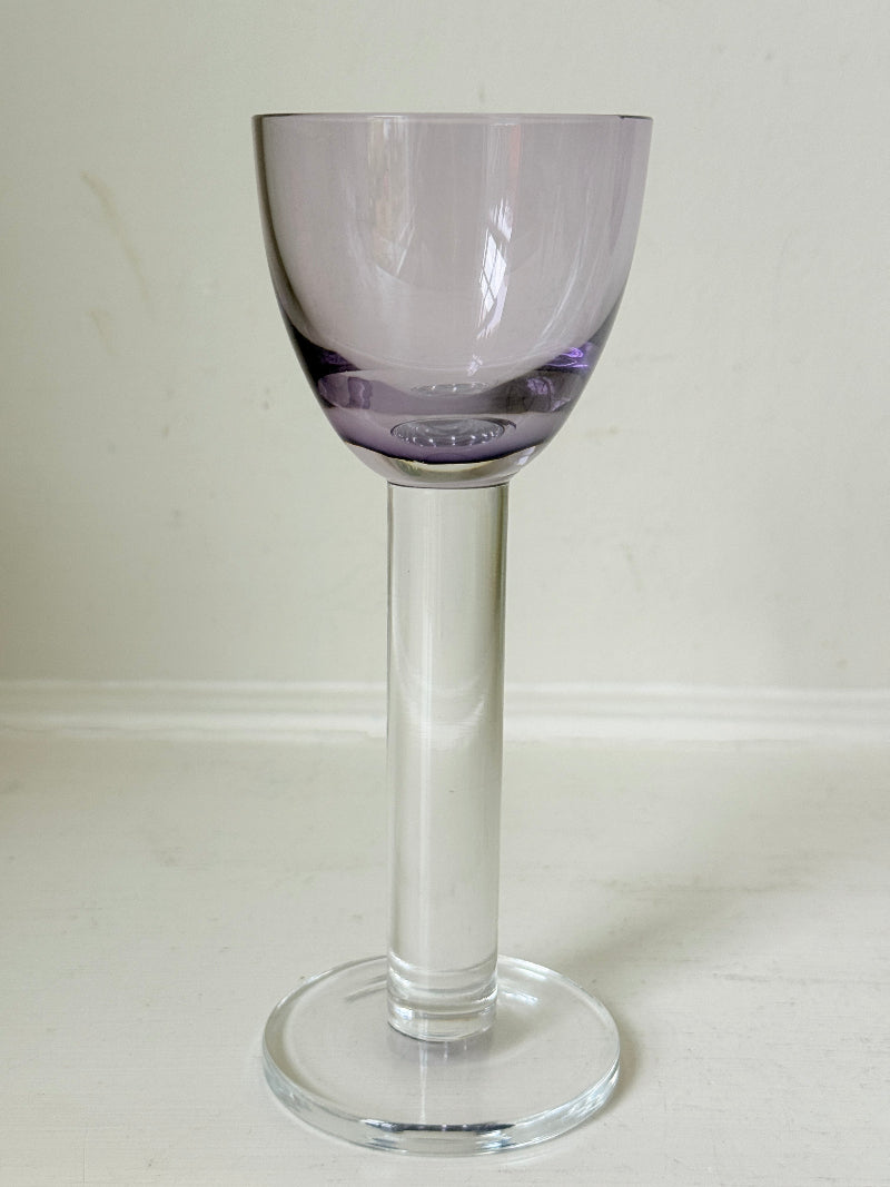 Set of 8 vintage lilac tinted liqueur glasses on a white surface