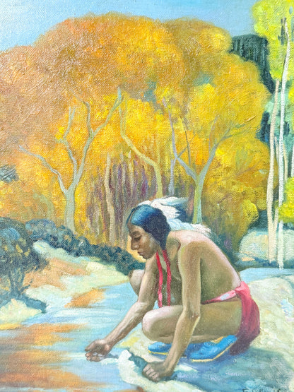 An oil painting depicting a Native American man crouching by a stream, looking down at the water. The background features a dense forest of golden-yellow autumn trees under a light blue sky.