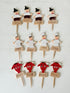 Vintage hand painted wooden steak markers on cocktail sticks labelled rare medium and well done, photographed on a white surface