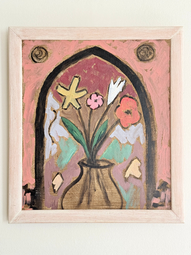 Modern British School oil on board painting of stylised flowers by a gothic arch in a pale frame, photographed against a light wall