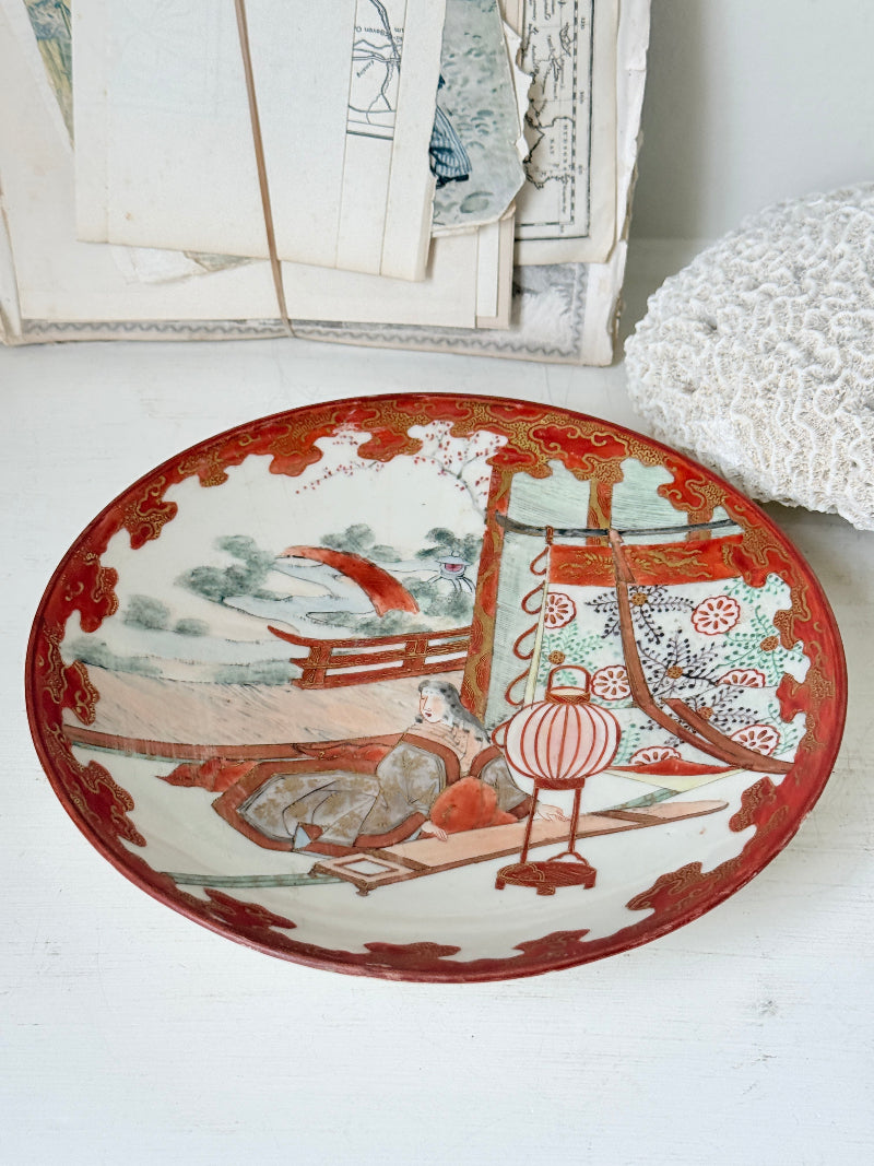 Japanese Kutani porcelain dish hand painted with a garden pavilion scene in iron red and gold
