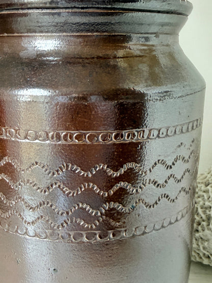 Vintage glazed stoneware pot with treacle brown glaze, incised banded decoration and wide rim for kitchen or shelf styling