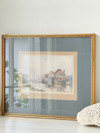 Vintage framed print of riverside mill by F Robson, gilt frame with blue mount, rustic water scene, photographed on white surface.