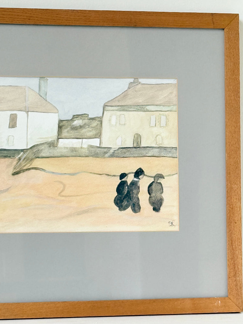 Framed neutral-toned village scene watercolour with figures in light oak-effect frame and pale grey mount, on white surface.