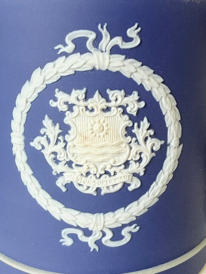 Adam’s blue jasperware loving cup with white classical relief decoration photographed on a white surface.