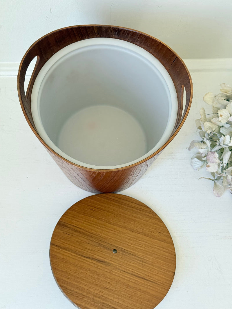 Vintage Swedish teak ice bucket with lid and white liner, photographed on a white surface
