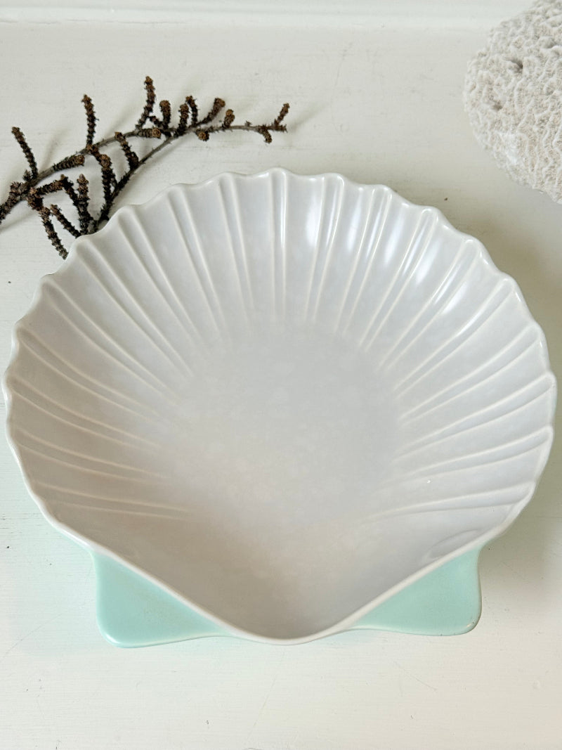 Poole Pottery scallop shell serving dish in white and seafoam glaze photographed on a white surface