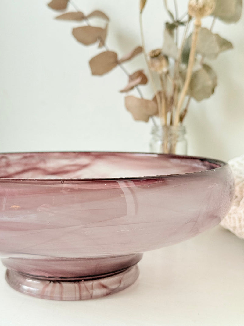 Vintage Davidson cloud glass bowl in mauve pink swirl photographed on a white surface