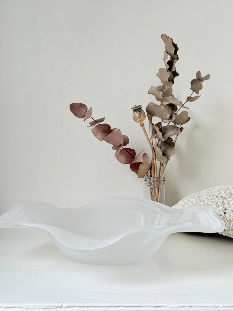 Large vintage white matt glass swirl ruffle bowl photographed on a white surface