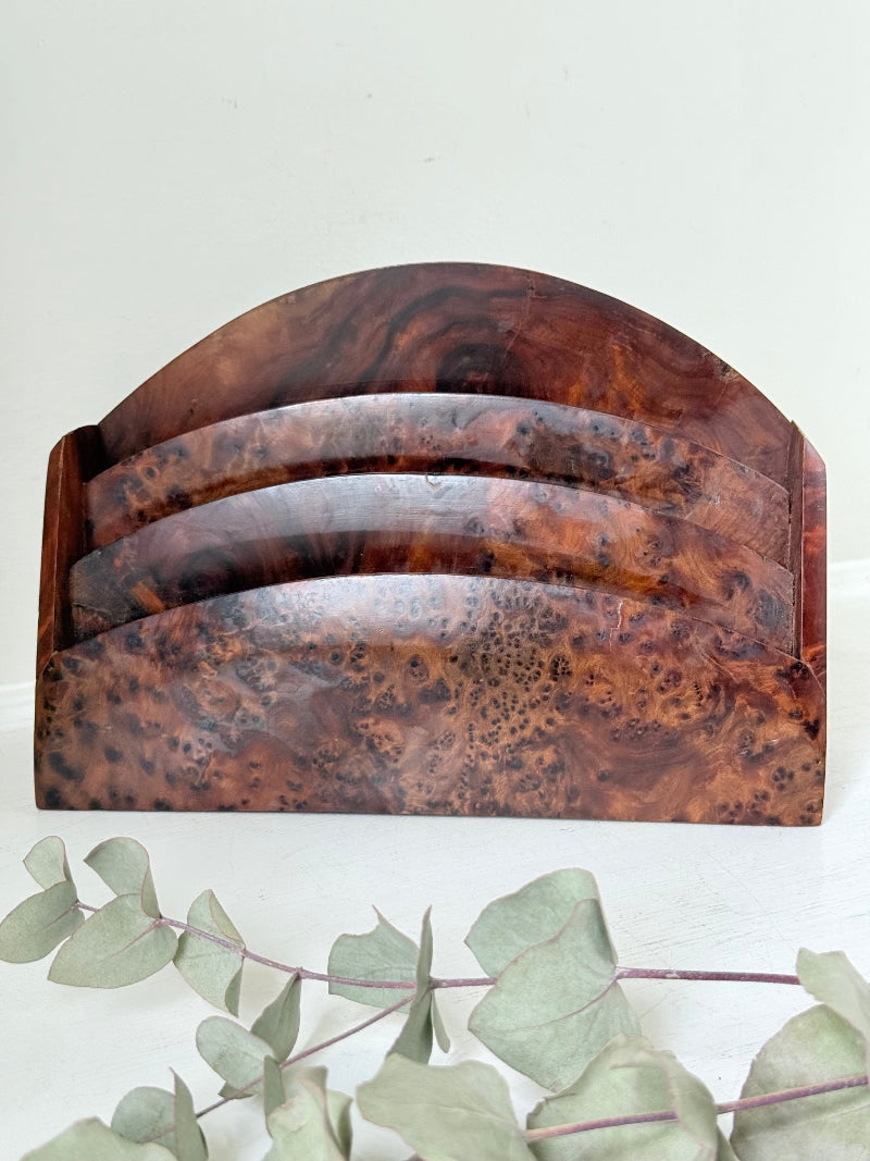 Three-slot curved letter rack made from polished burl wood with rich swirling grain, mid-century style desk organiser.