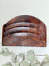 Three-slot curved letter rack made from polished burl wood with rich swirling grain, mid-century style desk organiser.