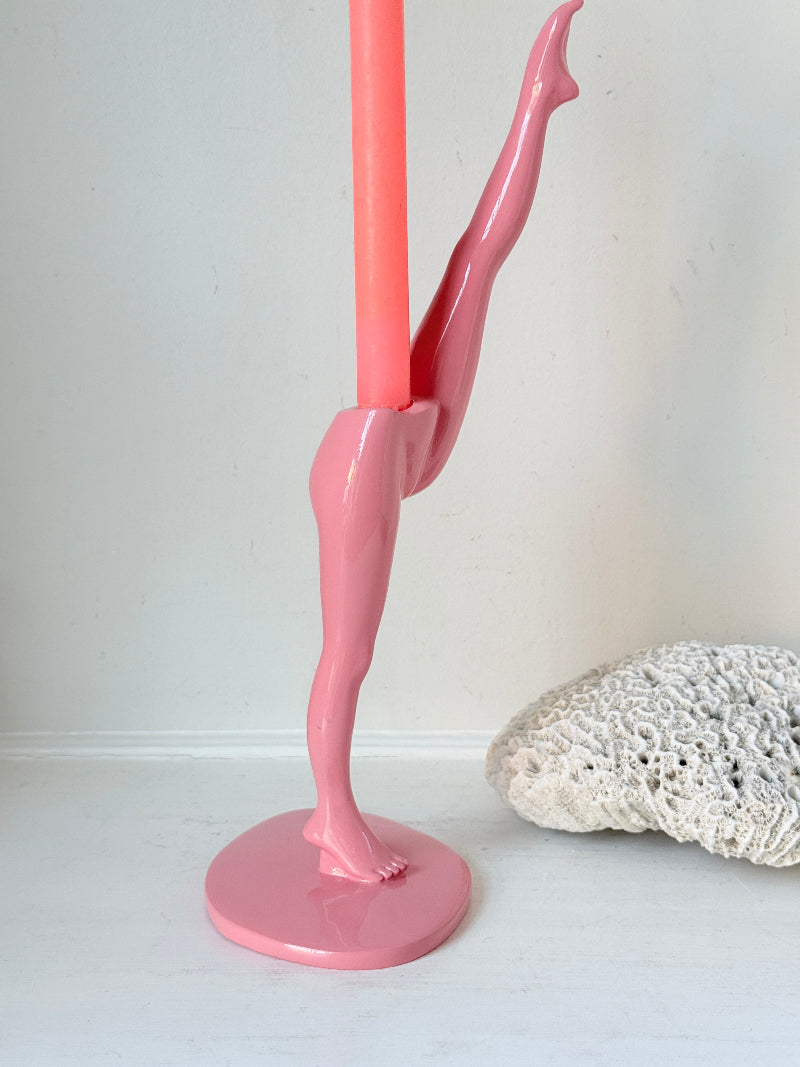 Anissa Kermiche Can Can Candlestick in Shine Pink resin with sculptural kicking leg design and taper candle