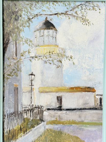 An impressionistic oil painting of a white lighthouse and adjacent buildings under a pale blue sky, with tree branches and greenery in the foreground.