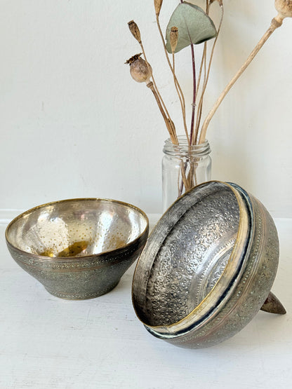 Indian Benares brass lidded jar with floral engraving and finial, photographed on a white surface