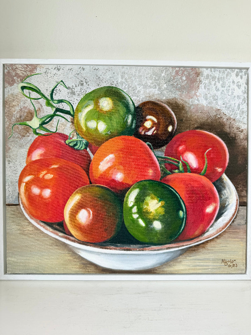 Framed artwork of tomatoes in a bowl on a textured surface