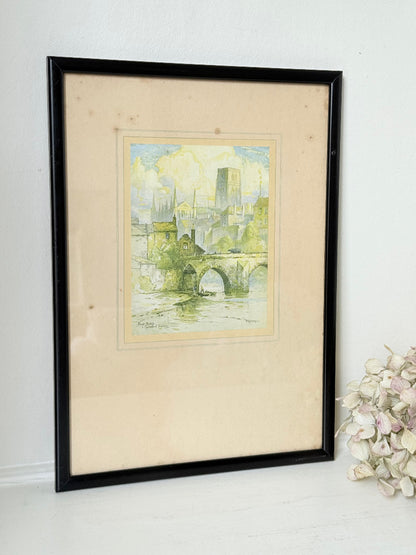 framed print of durham cathedral and elvet bridge with soft green and yellow tones photographed on white surface