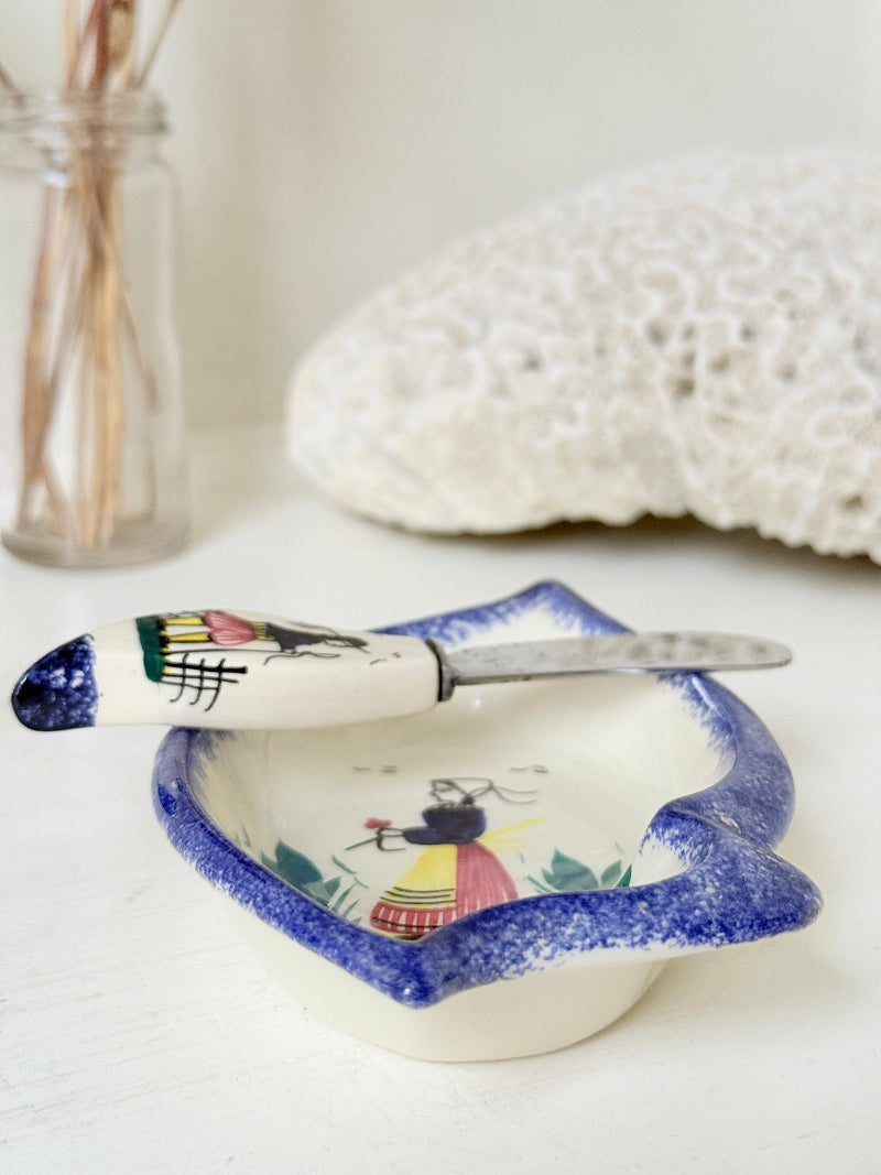 Vintage Quimper butter dish with ceramic knife, hand painted Breton figure, photographed on a white surface