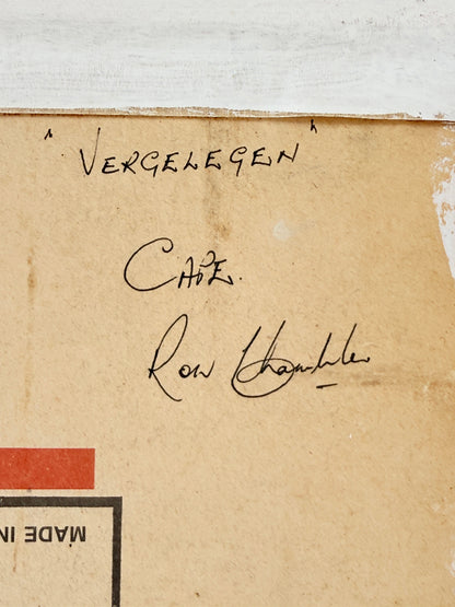 A close-up of a vintage beige paper card with handwritten black ink signatures reading &