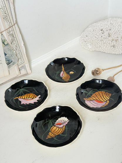 Set of 4 vintage Henriot Quimper faience plates with hand painted shell motifs, scalloped edges and black ground decoration