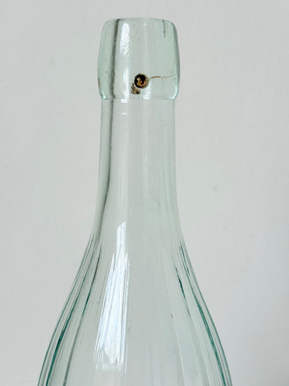 vintage french lemonade bottle la pétillante blue label on white surface with hydrangea flowers