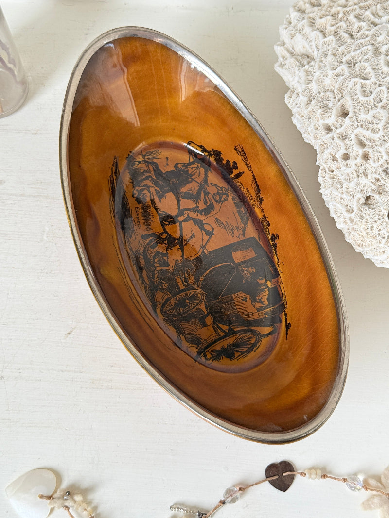 Antique Ridgways stoneware oval dish photographed on a white surface in amber treacle glaze with black Coaching Days and Coaching Ways transfer scene