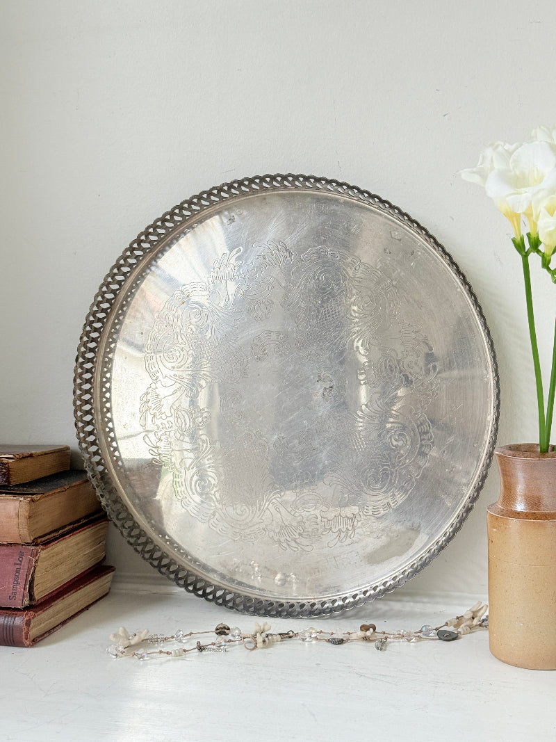 Vintage round silver plated gallery tray with pierced rim, engraved centre and aged patina for drinks or vanity styling