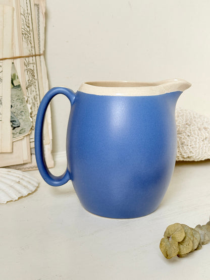 Vintage cornflower blue glazed stoneware jug with cream interior, pulled spout and curved handle for kitchen styling