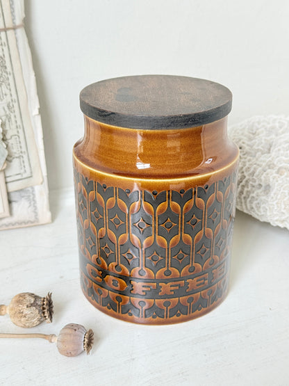 Hornsea Heirloom coffee storage jar in autumn brown stoneware with teak lid photographed on a white surface
