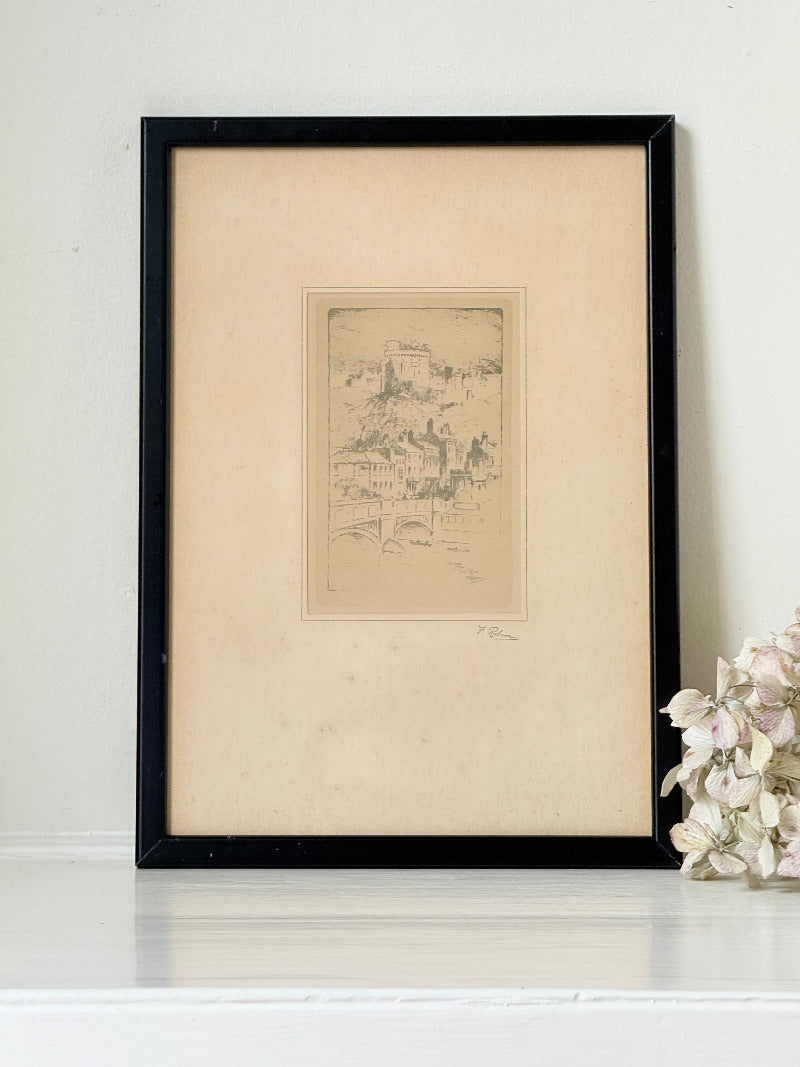 framed print of windsor castle viewed from the thames with fine line detail photographed on white surface