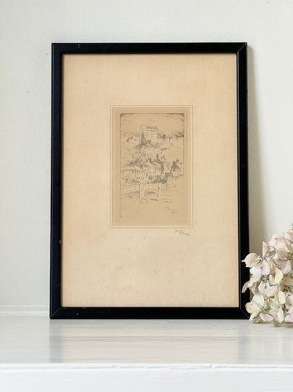 framed print of windsor castle viewed from the thames with fine line detail photographed on white surface