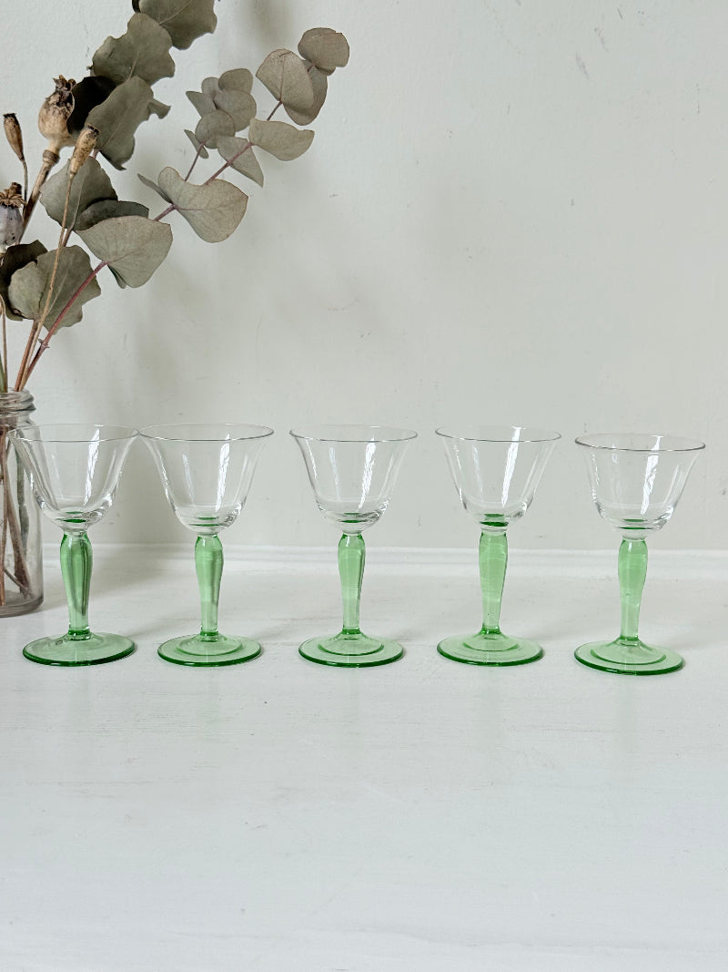 Set of five green stemmed liqueur glasses