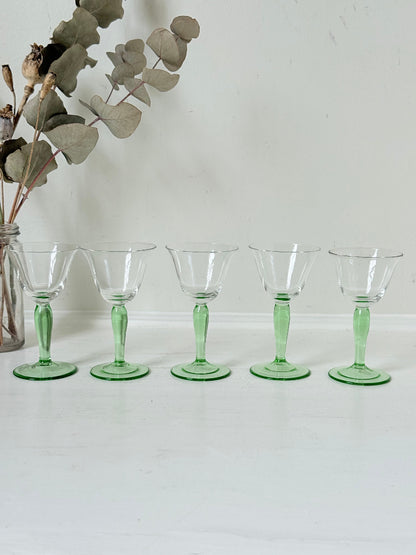 Set of five green stemmed liqueur glasses
