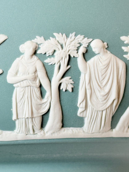 Large vintage Wedgwood Jasperware teal green fruit bowl decorated with white classical figures beneath stylised trees and a laurel garland border.