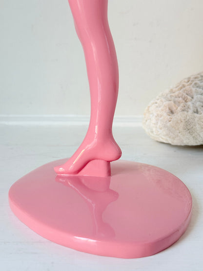 Anissa Kermiche Can Can Candlestick in Shine Pink resin with sculptural kicking leg design and taper candle