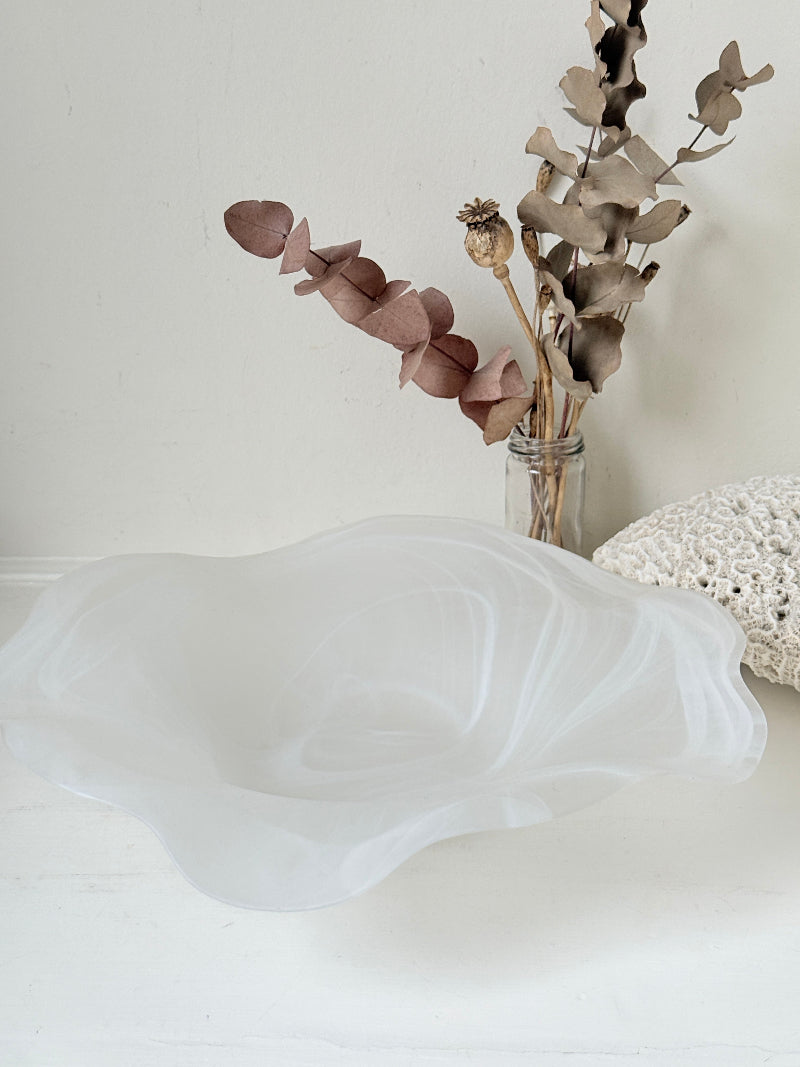 Large vintage white matt glass swirl ruffle bowl photographed on a white surface