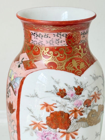 Japanese Kutani porcelain vase hand painted with flowers in white panels on an iron red and gold ground