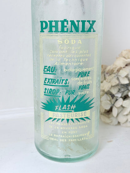 vintage french soda bottle phenix aqua green glass with ceramic swing top 31cm on white surface