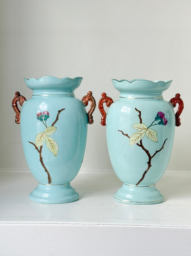Pair of Paris porcelain Aesthetic Movement vases from the late 1800s, hand painted with birds, blossom and coral handles