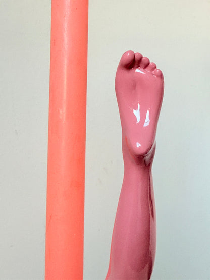 Anissa Kermiche Can Can Candlestick in Shine Pink resin with sculptural kicking leg design and taper candle