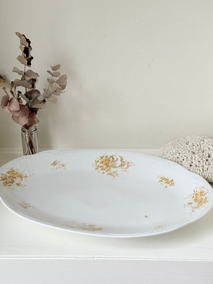 Antique Springer and Co Elbogen Senta porcelain platter in white with floral detail, photographed on a white surface