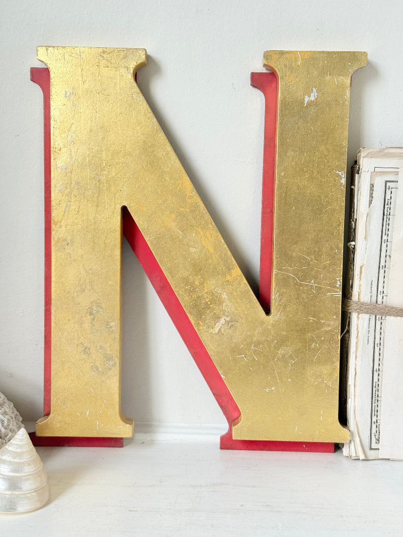 Vintage Shop Sign Letter N in Gold and Red with Serif Detail