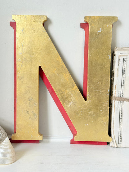Vintage Shop Sign Letter N in Gold and Red with Serif Detail