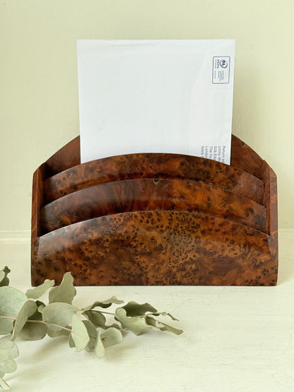 Three-slot curved letter rack made from polished burl wood with rich swirling grain, mid-century style desk organiser.