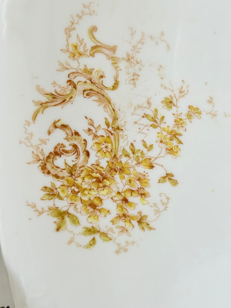 Antique Springer and Co Elbogen Senta porcelain platter in white with floral detail, photographed on a white surface