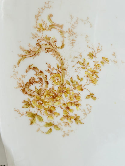 Antique Springer and Co Elbogen Senta porcelain platter in white with floral detail, photographed on a white surface