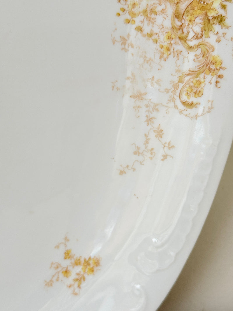 Antique Springer and Co Elbogen Senta porcelain platter in white with floral detail, photographed on a white surface
