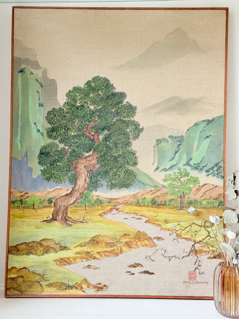 Vintage Chinese watercolour landscape on canvas with tree, mountains and blossom, photographed on white surface
