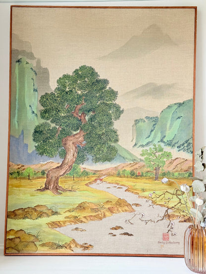 Vintage Chinese watercolour landscape on canvas with tree, mountains and blossom, photographed on white surface