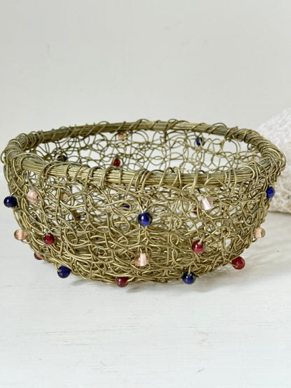 Vintage brass wire basket with coloured glass beads, photographed from multiple angles on a white surface
