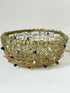 Vintage brass wire basket with coloured glass beads, photographed from multiple angles on a white surface